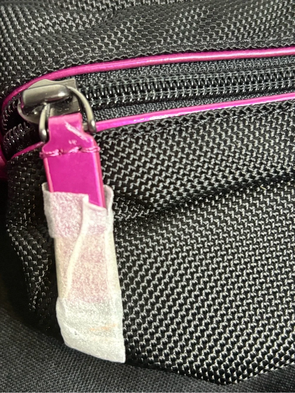 Tumi Black Travel Pouch with Pink Accents